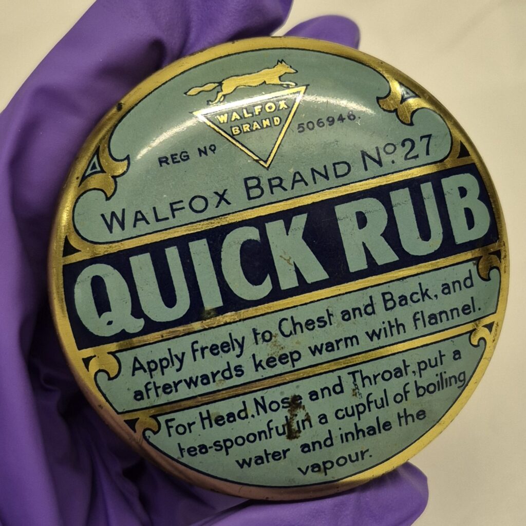 Circular tin with duck egg blue, gold and black design on lid. Text reads ' Walfox brand no 27, Quick rub along with usage instruction.